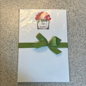 CHANEL No. 5 Notepad with Pink Floral Design in Perfume Bottle.